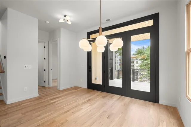 a kitchen with stainless steel appliances granite countertop a sink a refrigerator and a stove