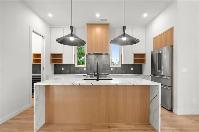 a kitchen that has a sink and a stove