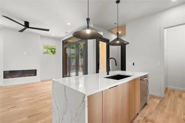 a view of an empty room and wooden floor