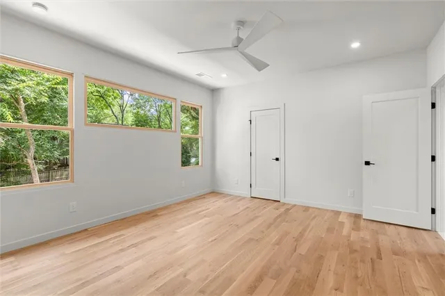 a bathroom with a shower and a sink