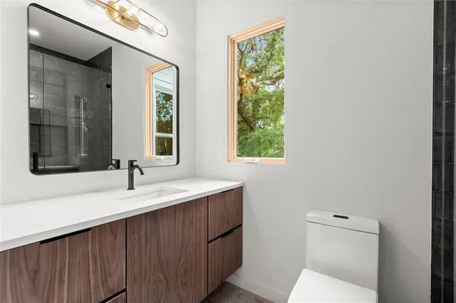 a bathroom with a double vanity sink and mirror