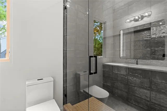 a bathroom with a bathtub and a shower