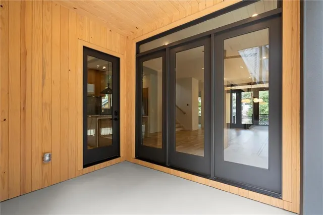 a view of a kitchen with wooden floor and a ceiling fan