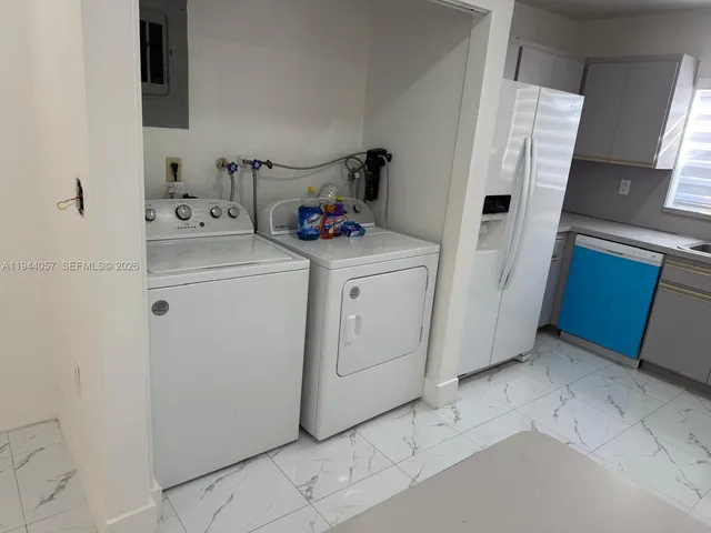 a utility room with dryer and washer