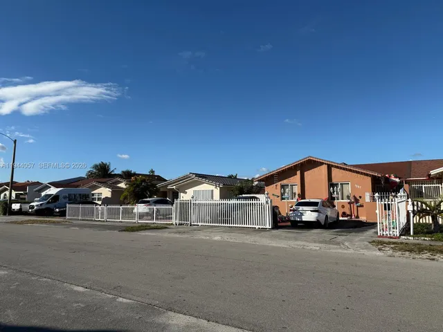 a view of car parked in front of a house