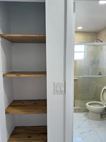 a bathroom with a sink and toilet