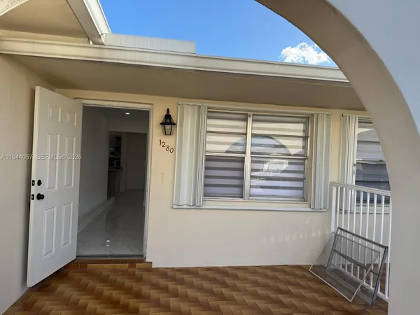 a view of a hallway with a window
