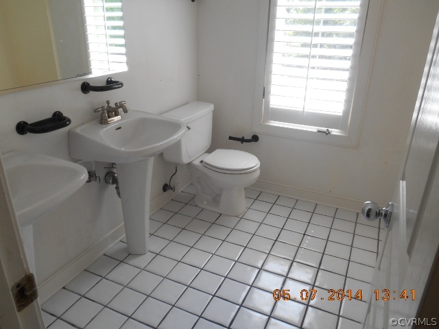 2913 Old Gun Road West Midlothian, VA 23113 - Photo 17 of 24 a bathroom with a sink toilet and window