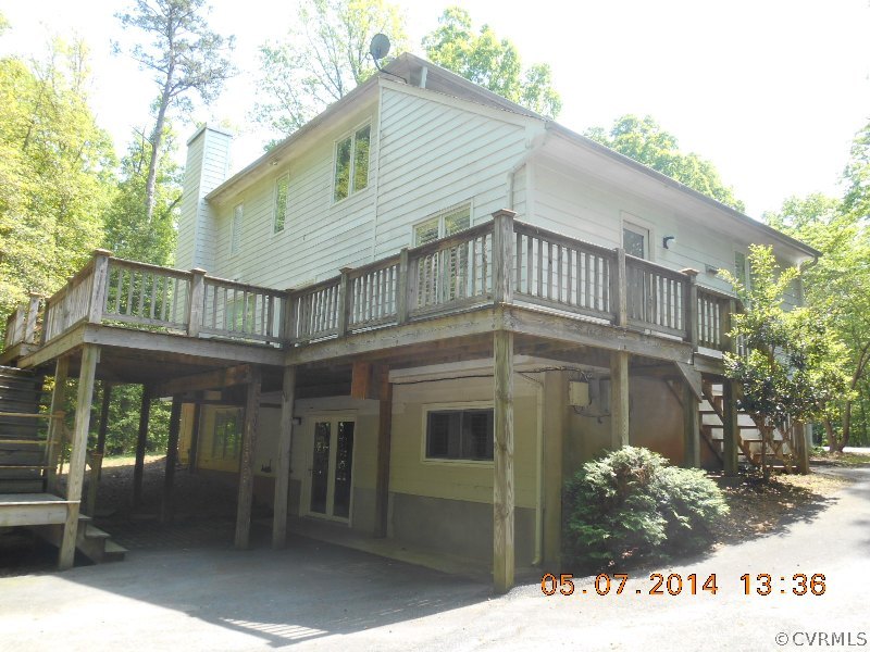 2913 Old Gun Road West Midlothian, VA 23113 - Photo 2 of 24 a front view of a house with a garden