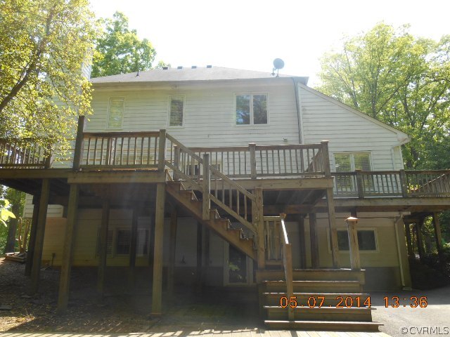 2913 Old Gun Road West Midlothian, VA 23113 - Photo 3 of 24 a front view of a house with a balcony