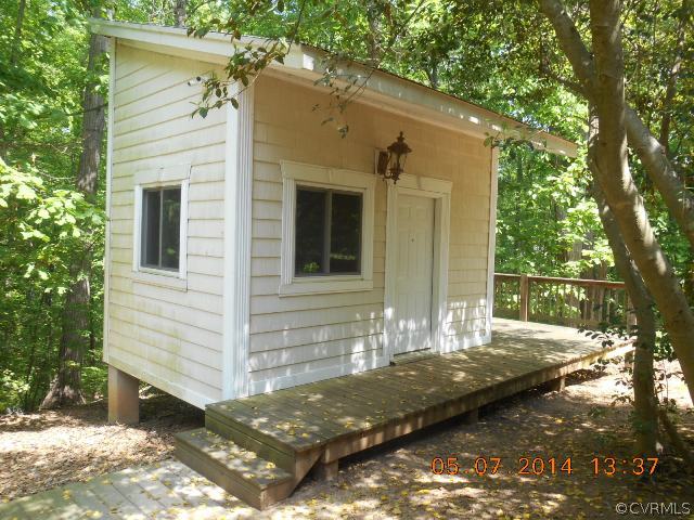 2913 Old Gun Road West Midlothian, VA 23113 - Photo 4 of 24 a view of a back yard of the house
