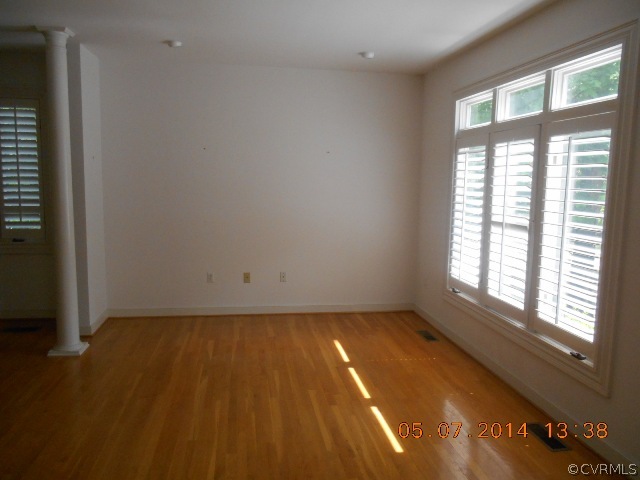 2913 Old Gun Road West Midlothian, VA 23113 - Photo 6 of 24 an empty room with wooden floor and windows