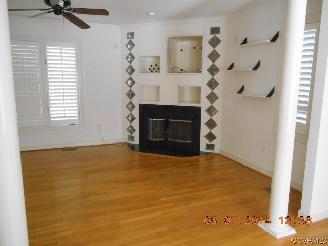 2913 Old Gun Road West Midlothian, VA 23113 - Photo 7 of 24 a room with a fireplace and a fireplace