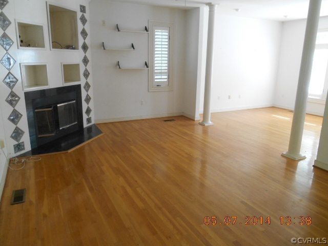 2913 Old Gun Road West Midlothian, VA 23113 - Photo 8 of 24 a view of empty room with a fireplace