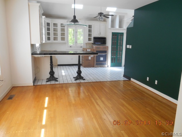 2913 Old Gun Road West Midlothian, VA 23113 - Photo 10 of 24 a kitchen with kitchen island a sink stove and refrigerator