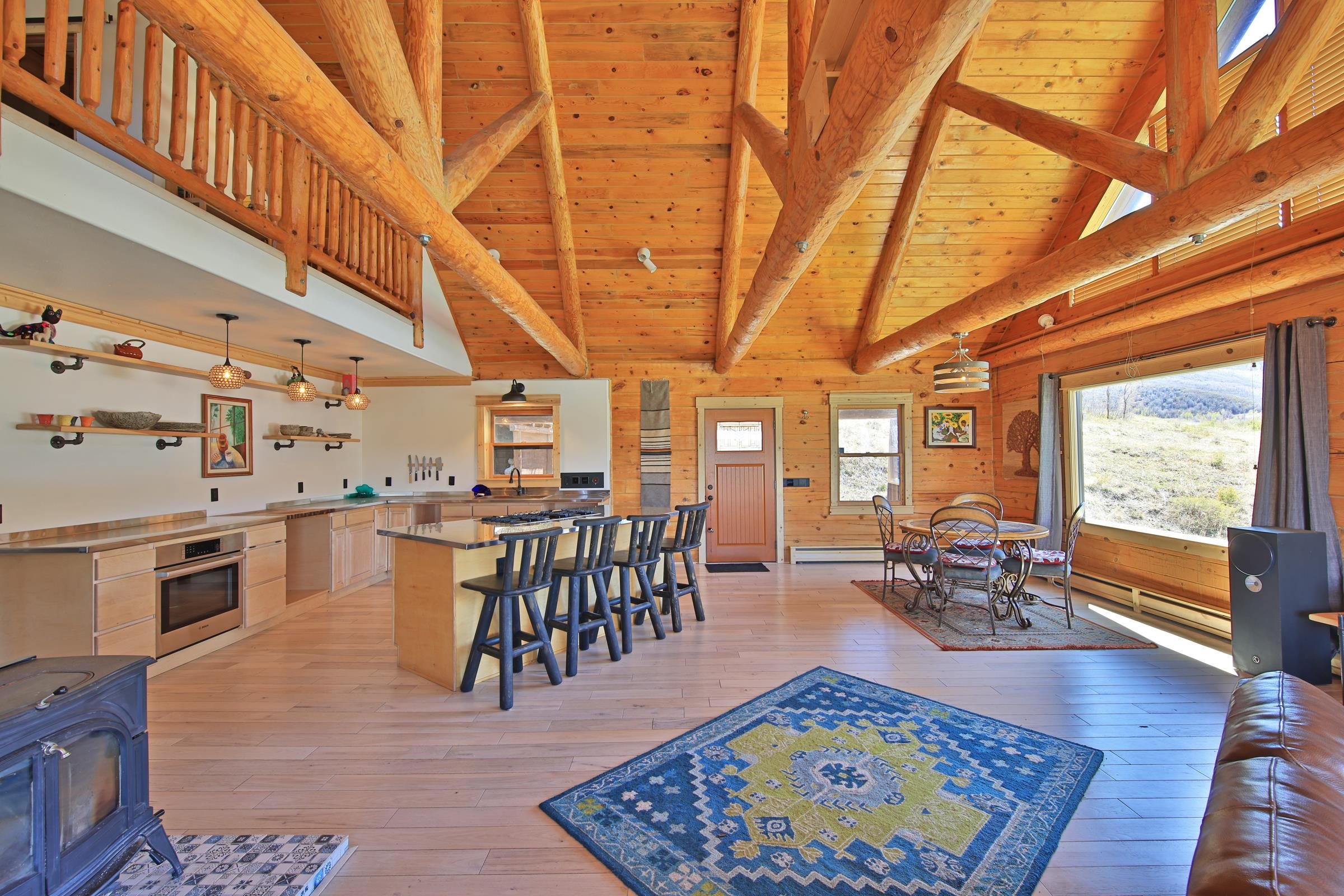 10822-60 60 75/100 Road Collbran, CO 81624 - Photo 12 of 42 a view of a dining room with furniture window and wooden floor