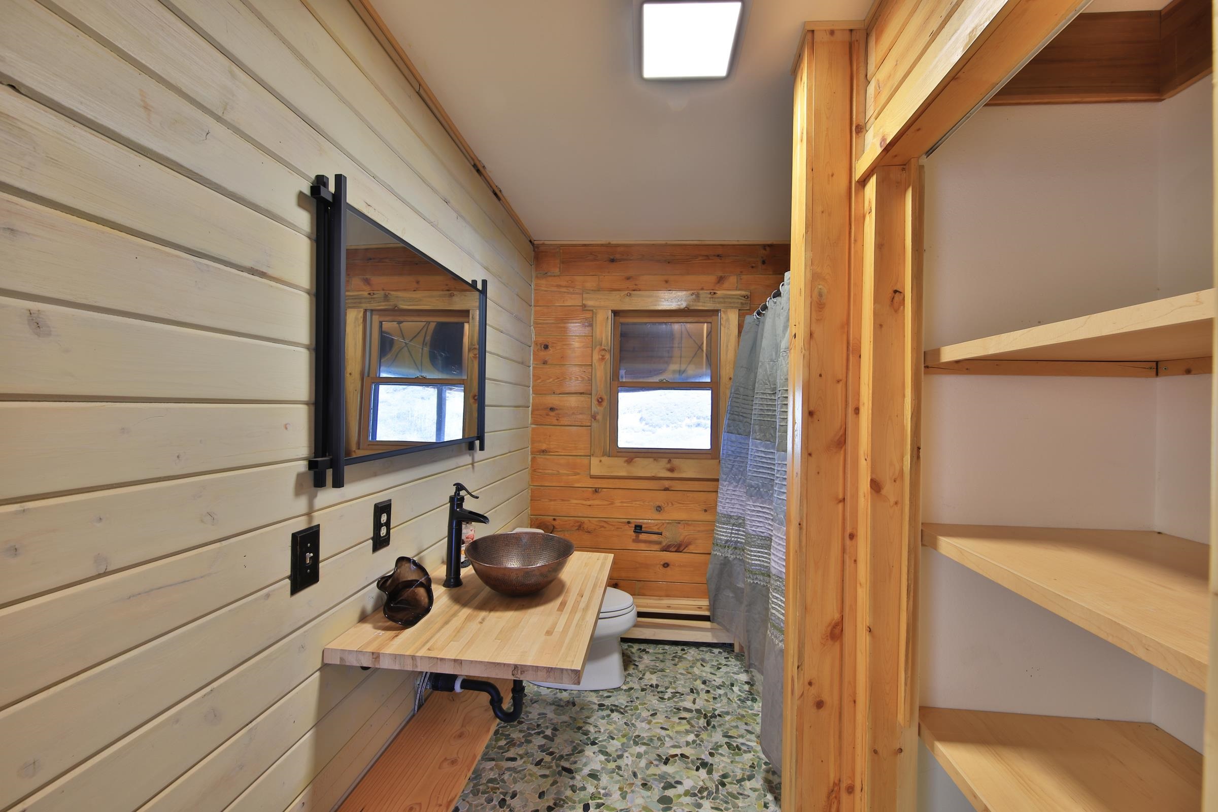 10822-60 60 75/100 Road Collbran, CO 81624 - Photo 15 of 42 a bathroom with a sink a toilet and shower