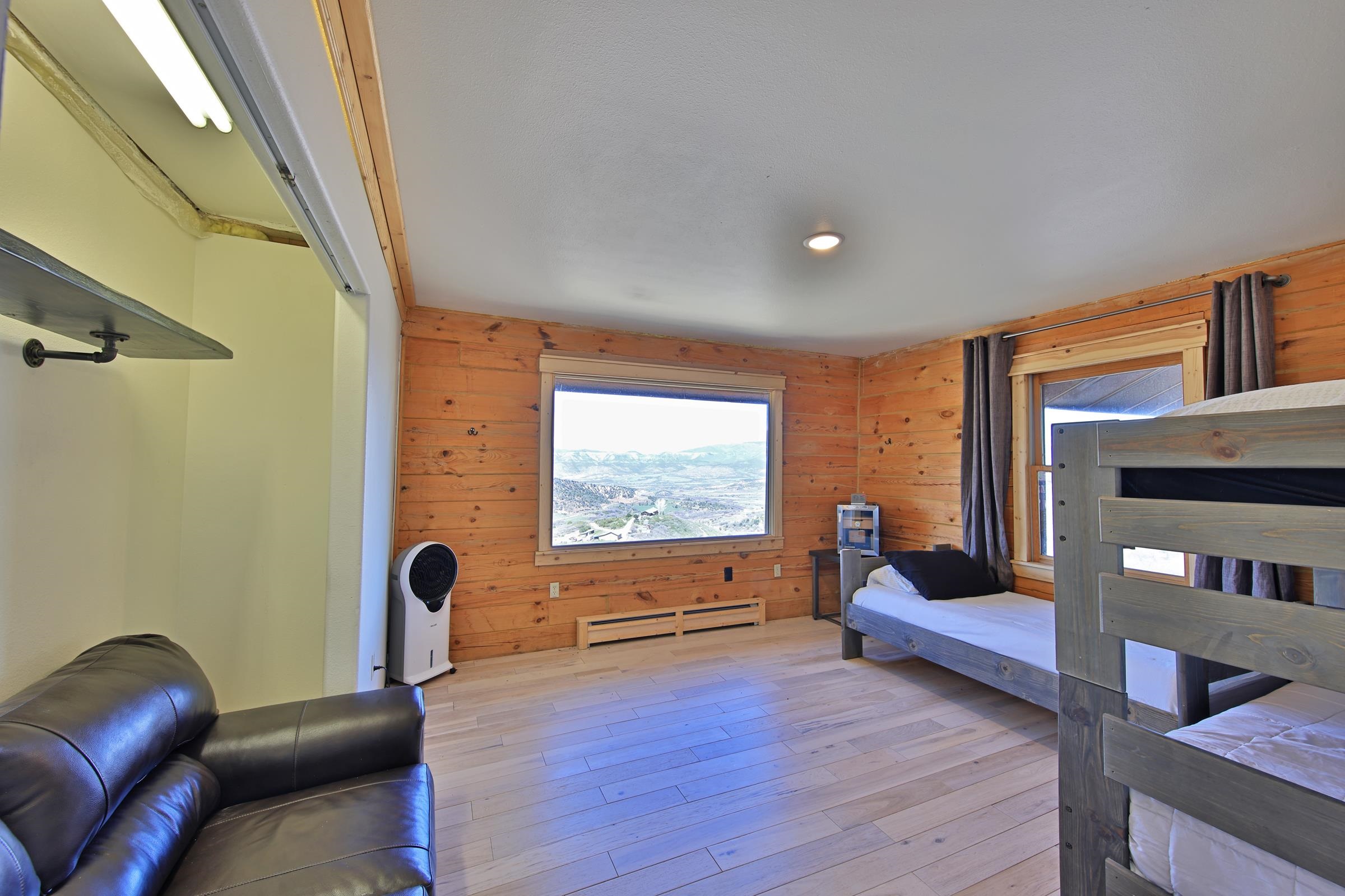 10822-60 60 75/100 Road Collbran, CO 81624 - Photo 16 of 42 a living room with furniture and a flat screen tv
