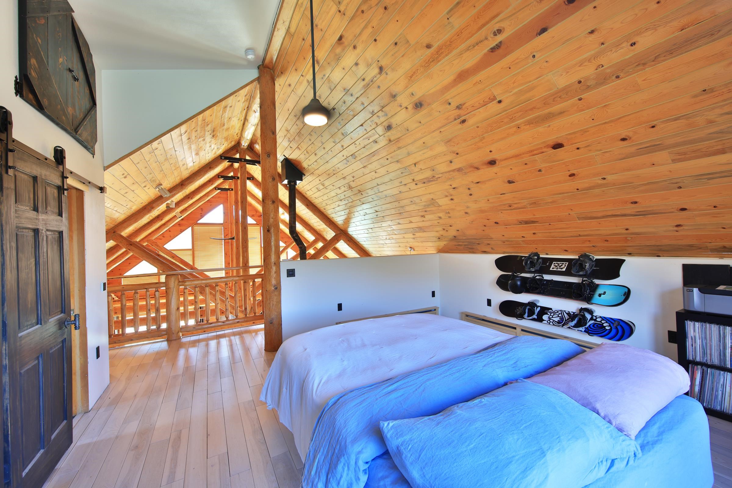 10822-60 60 75/100 Road Collbran, CO 81624 - Photo 20 of 42 a bedroom with a bed and wooden floor