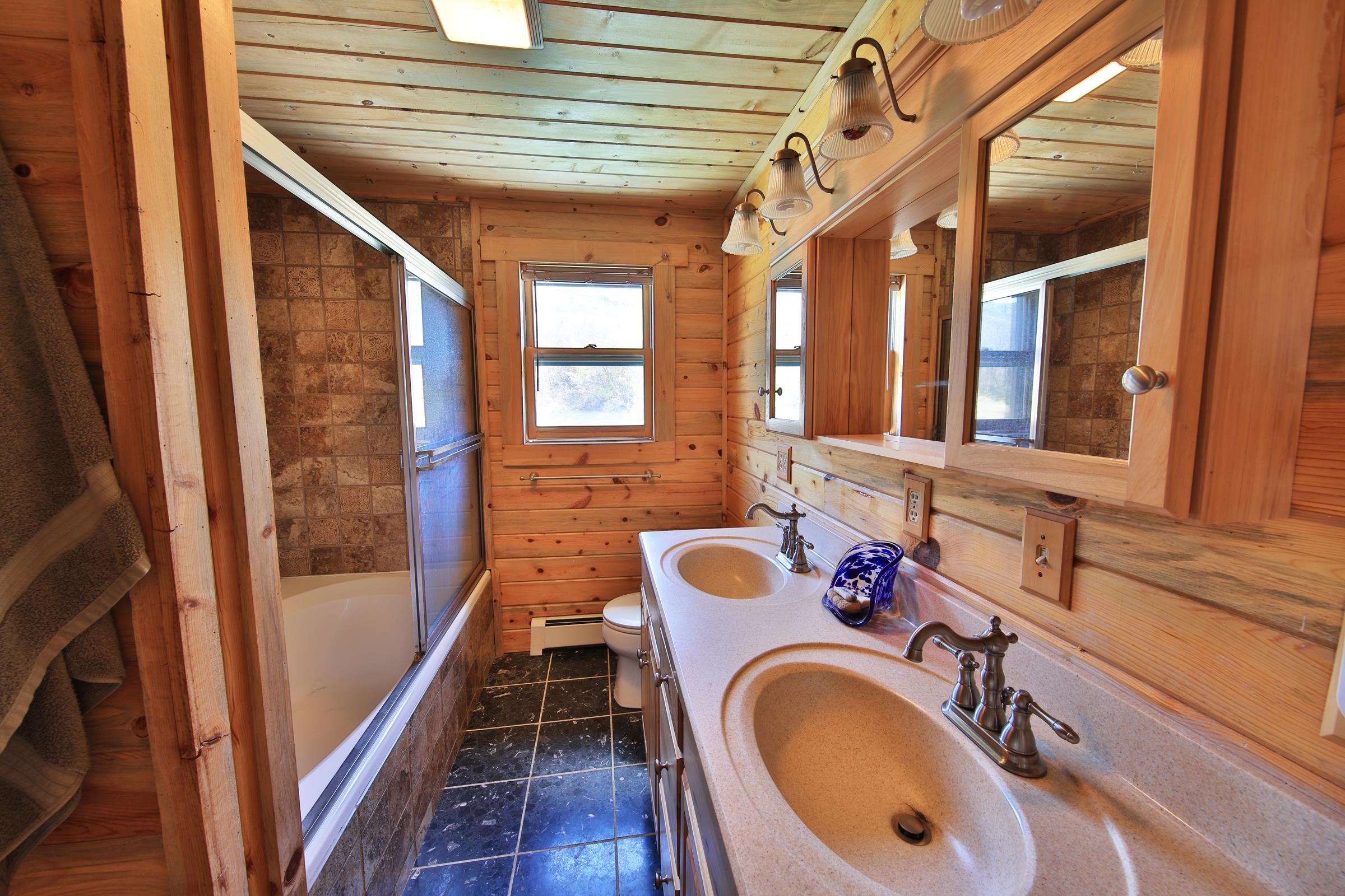 10822-60 60 75/100 Road Collbran, CO 81624 - Photo 21 of 42 a bathroom with a sink and a mirror