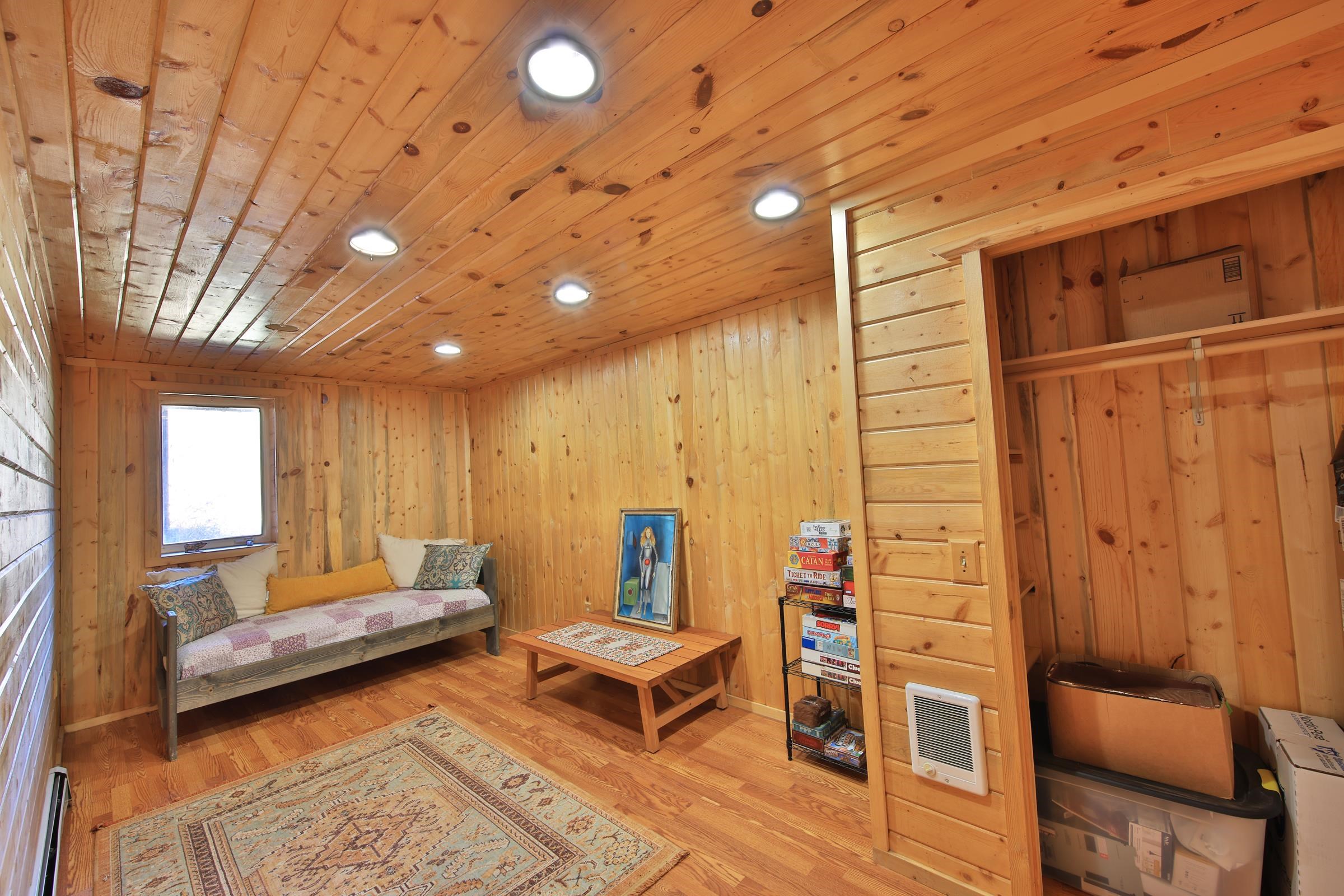 10822-60 60 75/100 Road Collbran, CO 81624 - Photo 25 of 42 a living room with furniture a rug and a wooden floor