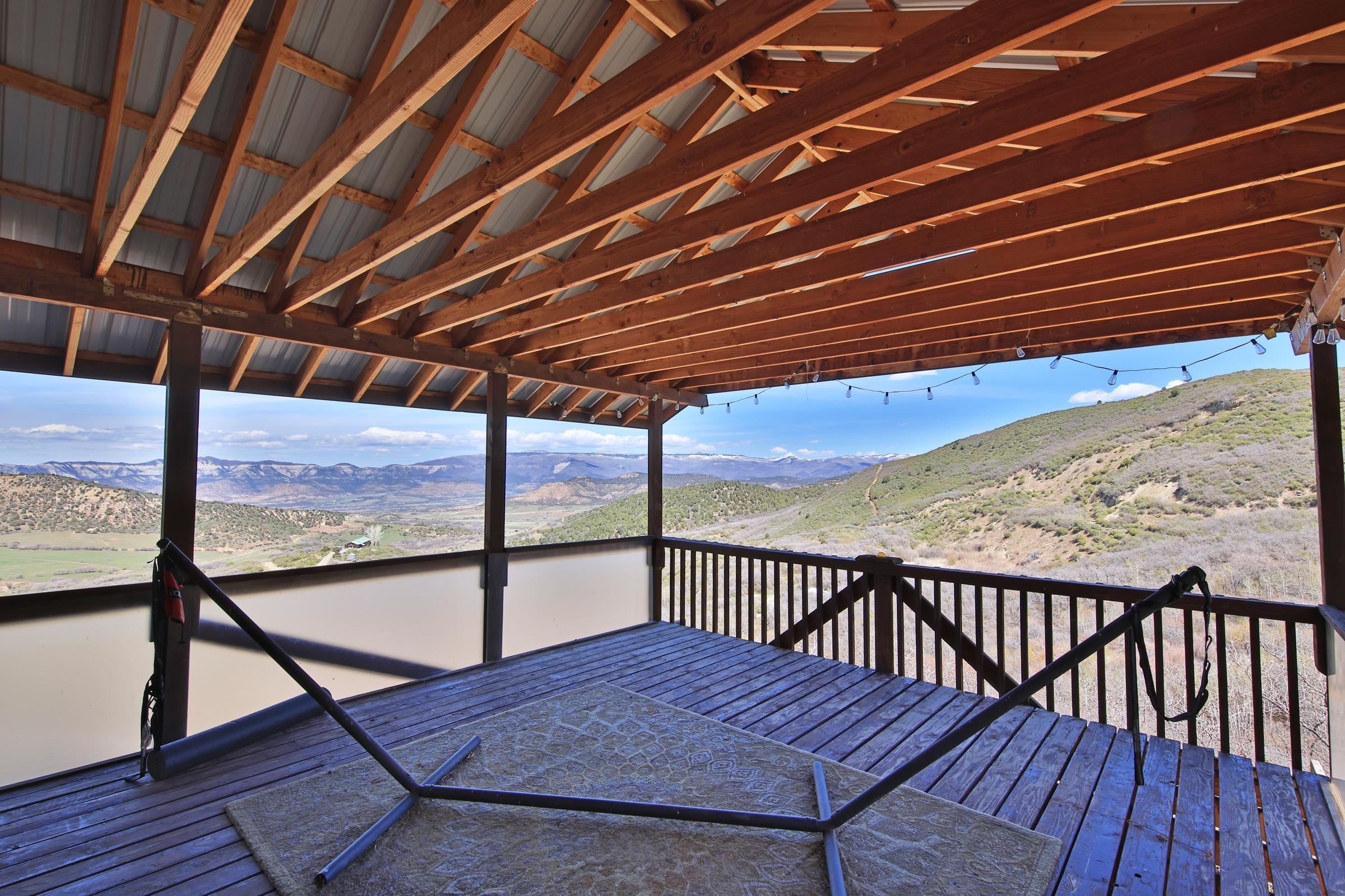10822-60 60 75/100 Road Collbran, CO 81624 - Photo 29 of 42 a view of balcony with wooden floor
