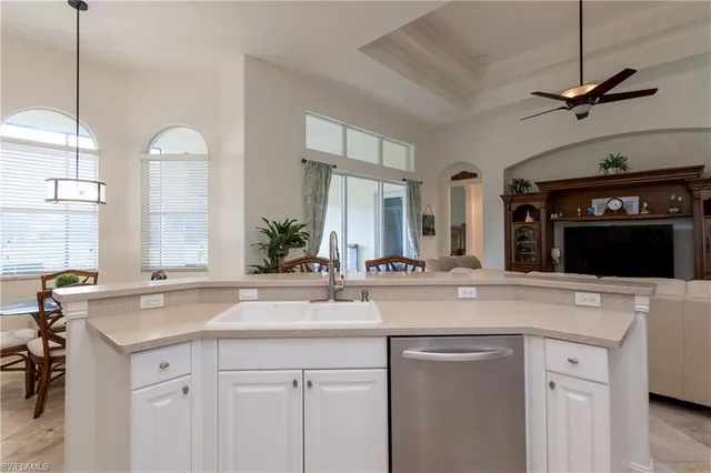 a sink with a granite countertop sink and a mirror