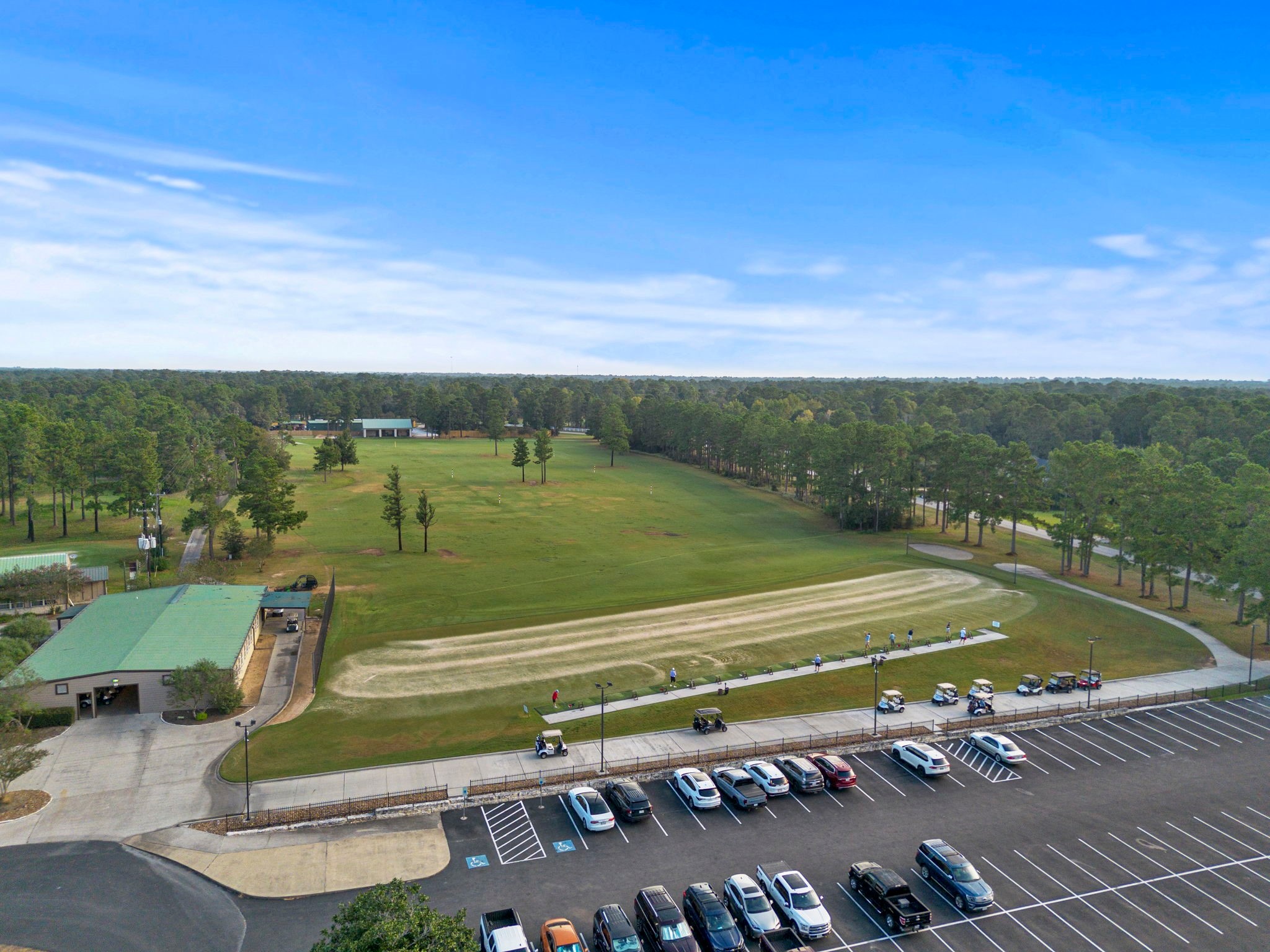 37432 Clubhouse Lane Magnolia, TX 77355 - Photo 22 of 30 a view of a tennis ground with large trees