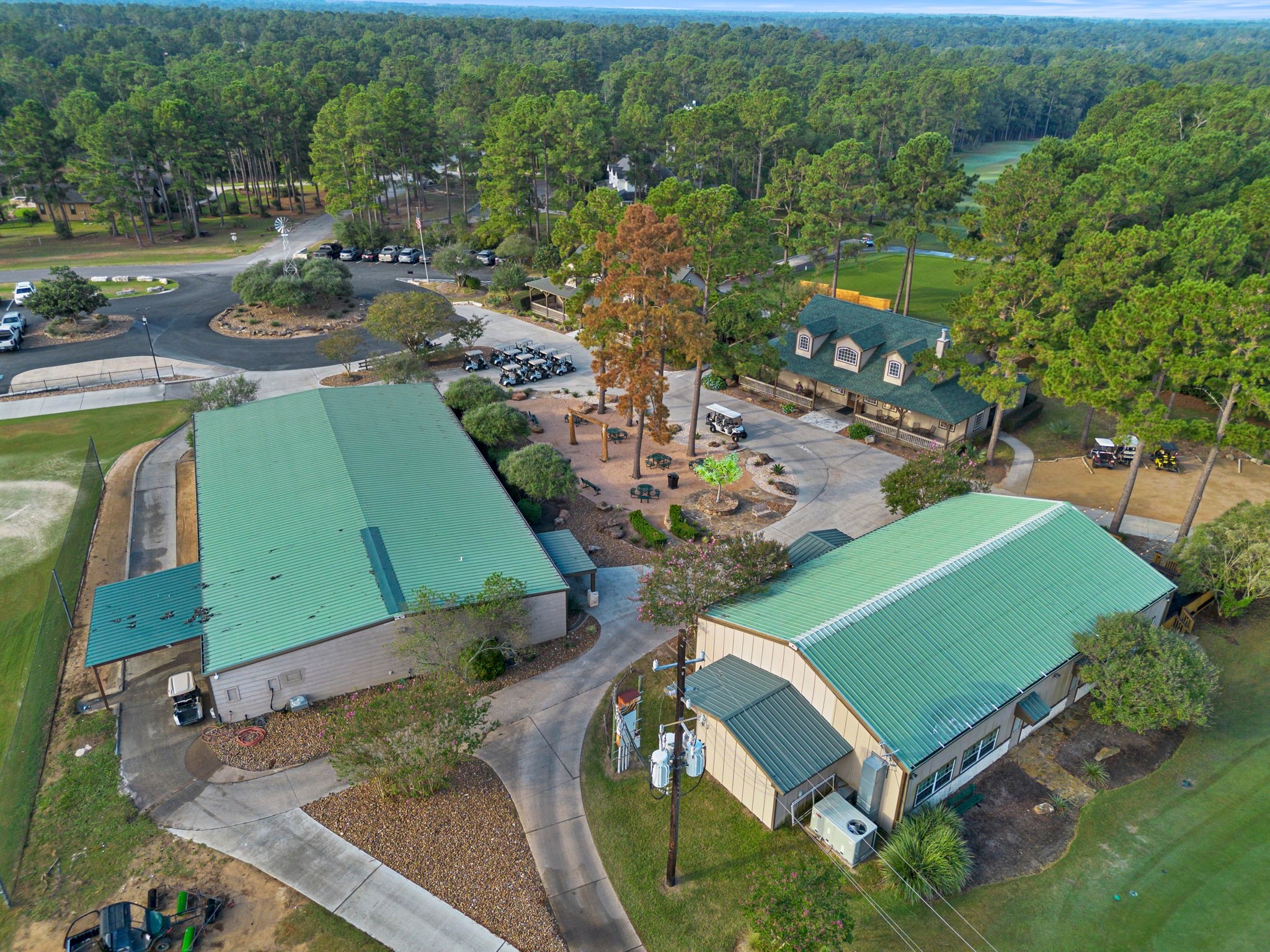 37432 Clubhouse Lane Magnolia, TX 77355 - Photo 25 of 30 an aerial view of a tennis ground and a cars park side of the road
