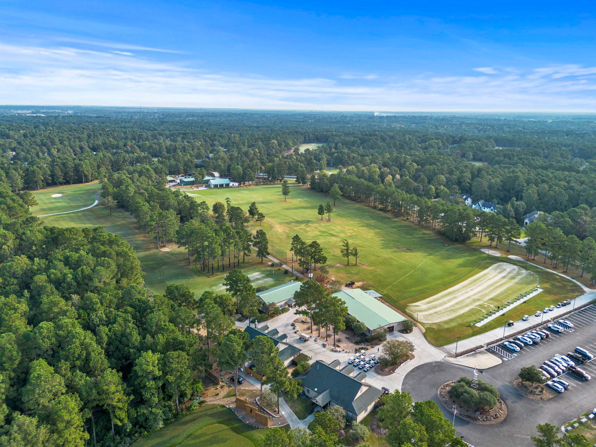 37432 Clubhouse Lane Magnolia, TX 77355 - Photo 26 of 30 a view of a lake with a city
