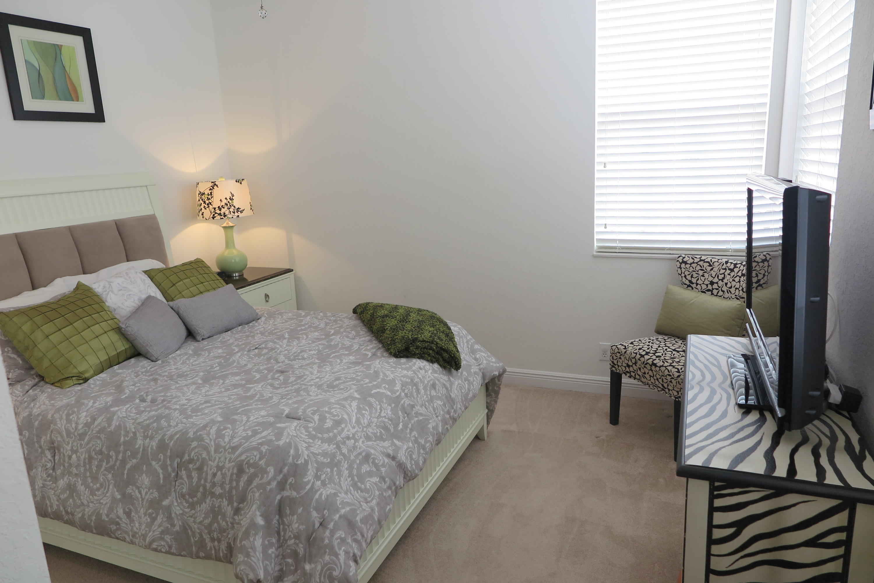 819 Northwest 82nd Place Boca Raton, FL 33487 - Photo 15 of 25 a bedroom with a bed and a couch