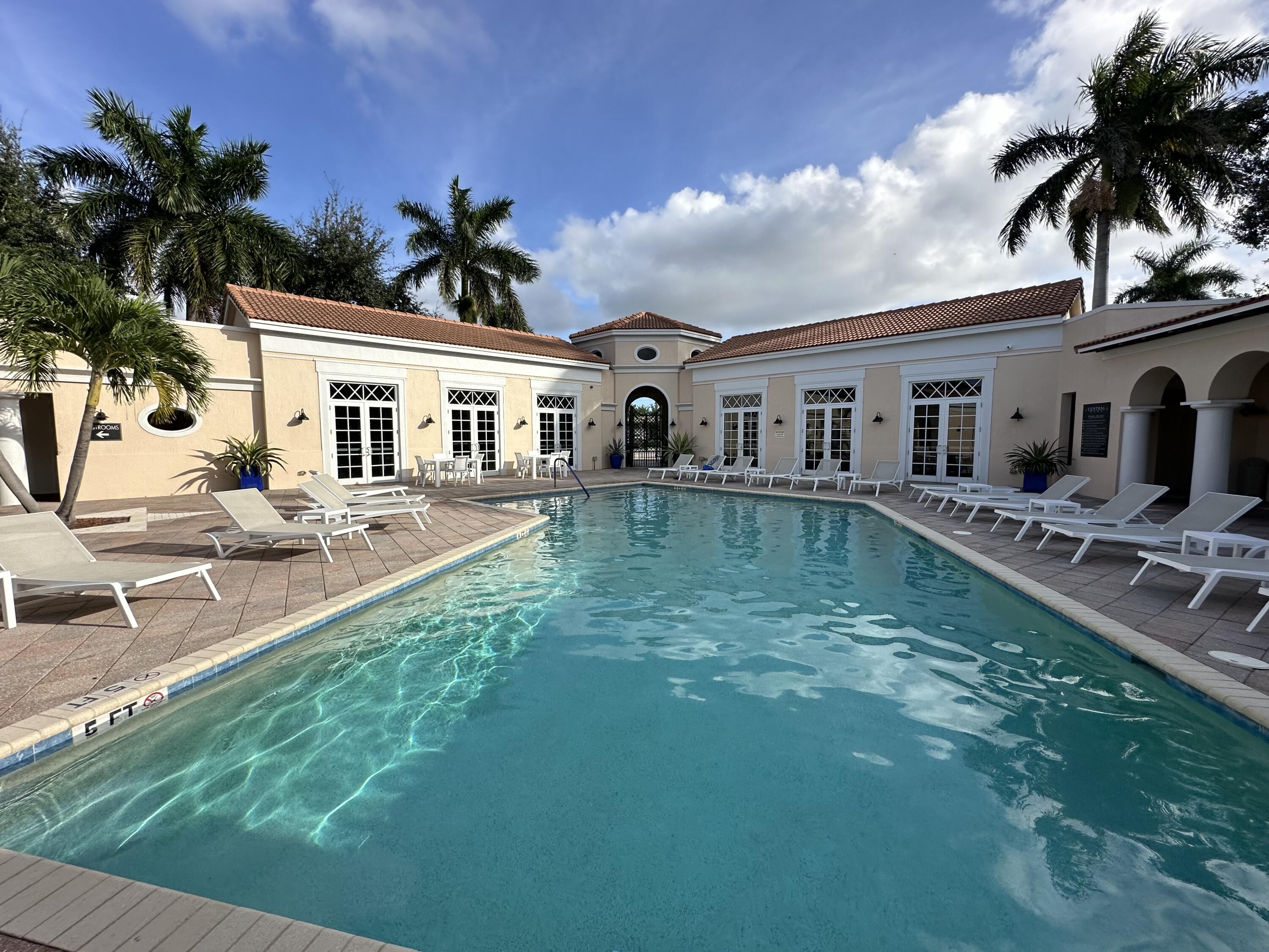 819 Northwest 82nd Place Boca Raton, FL 33487 - Photo 21 of 25 a view of a house with a yard patio and swimming pool