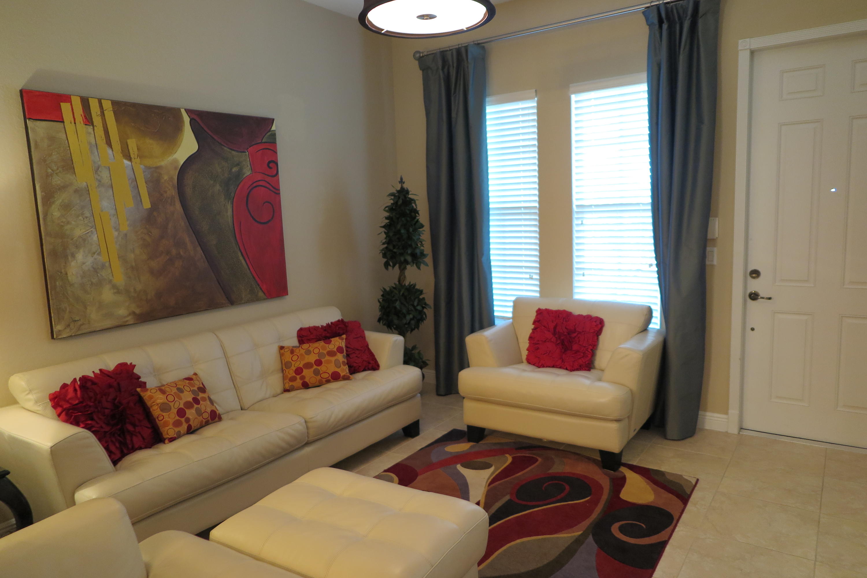 819 Northwest 82nd Place Boca Raton, FL 33487 - Photo 3 of 25 a living room with furniture and a large window
