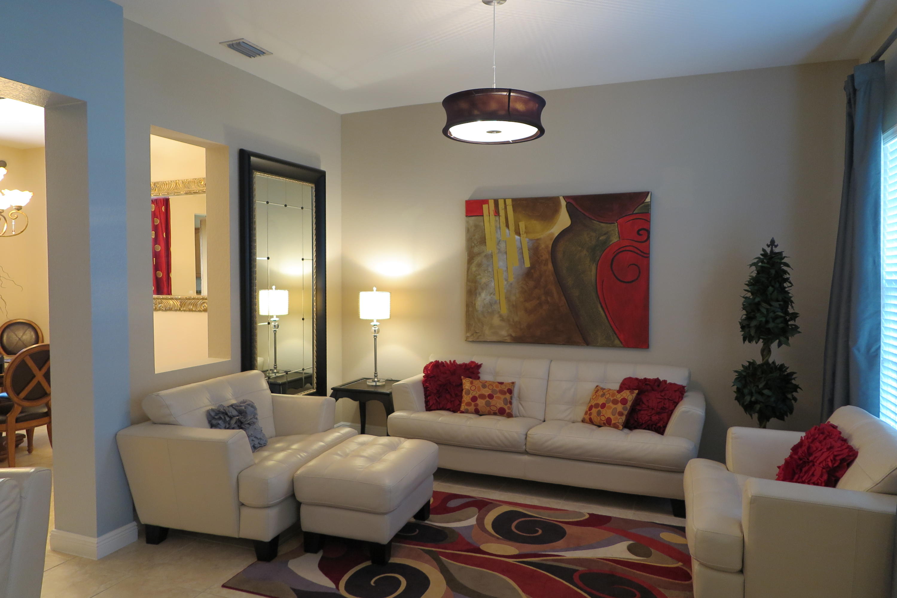 819 Northwest 82nd Place Boca Raton, FL 33487 - Photo 4 of 25 a living room with furniture and a potted plant