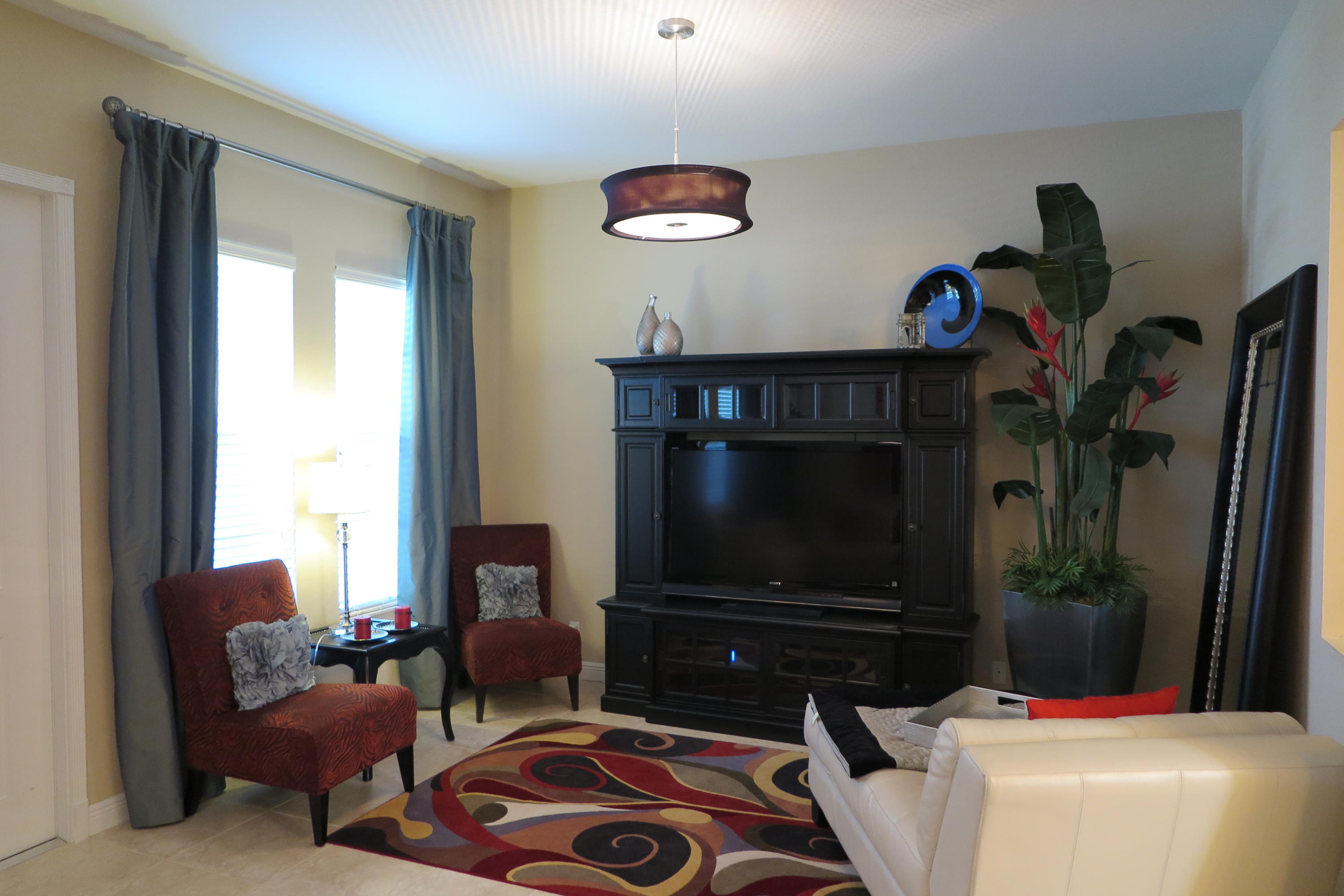 819 Northwest 82nd Place Boca Raton, FL 33487 - Photo 5 of 25 a living room with furniture and a flat screen tv