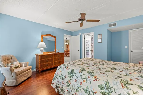 a bedroom with a bed and a dresser