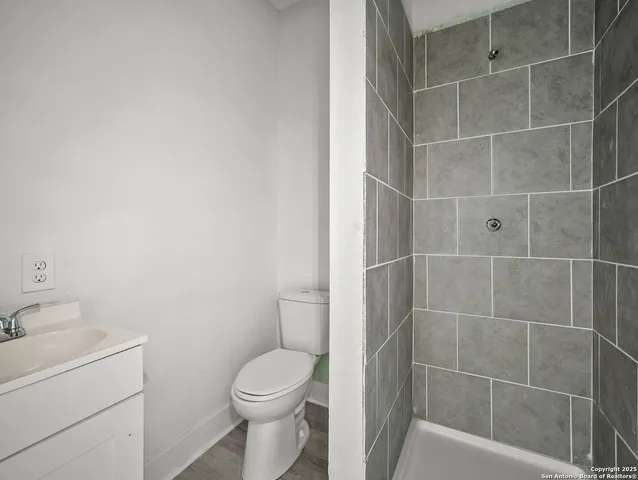 a bathroom with a toilet and a sink