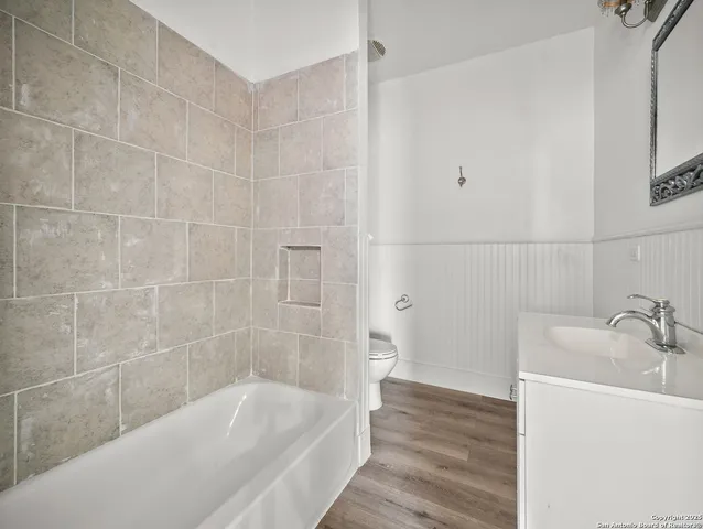 a bathroom with a bathtub and shower