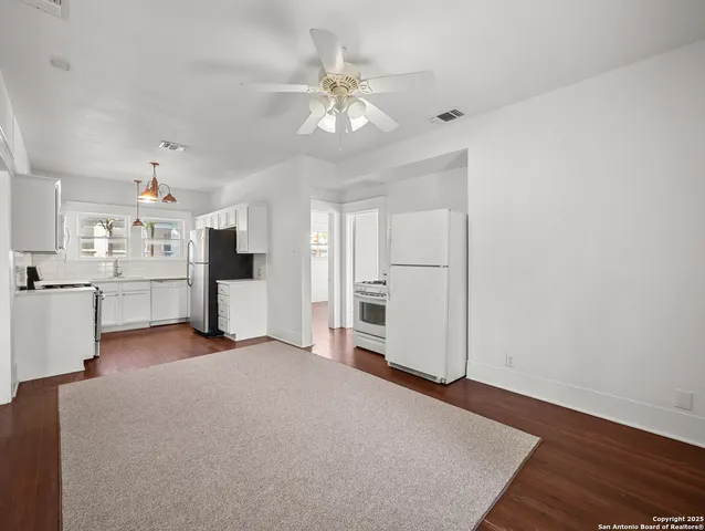 a view of a kitchen with a sink and cabinet area