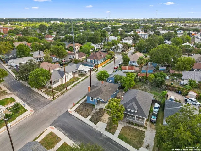 an aerial view of residential house with outdoor space and lake view