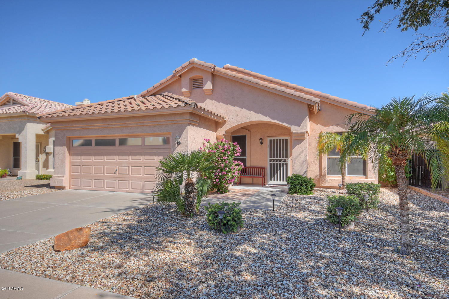 124 West Grandview Road Phoenix, AZ 85023 - Photo 1 of 21 a front view of a house with garden
