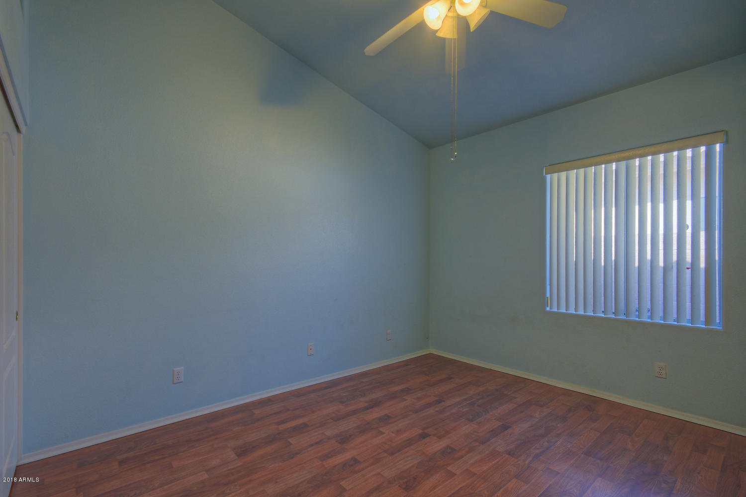 124 West Grandview Road Phoenix, AZ 85023 - Photo 16 of 21 an empty room with wooden floor and windows