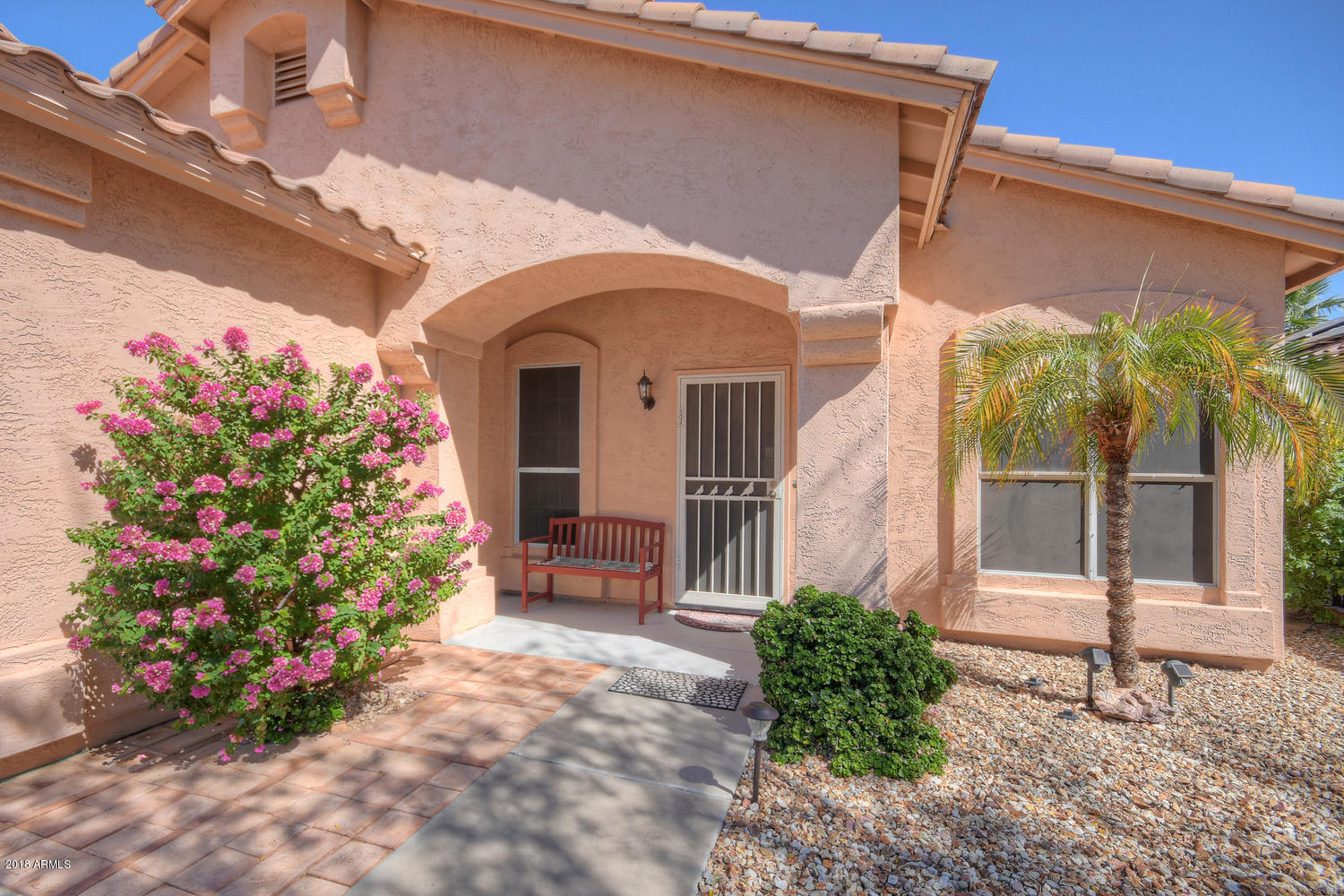 124 West Grandview Road Phoenix, AZ 85023 - Photo 2 of 21 a front view of a house with a garden