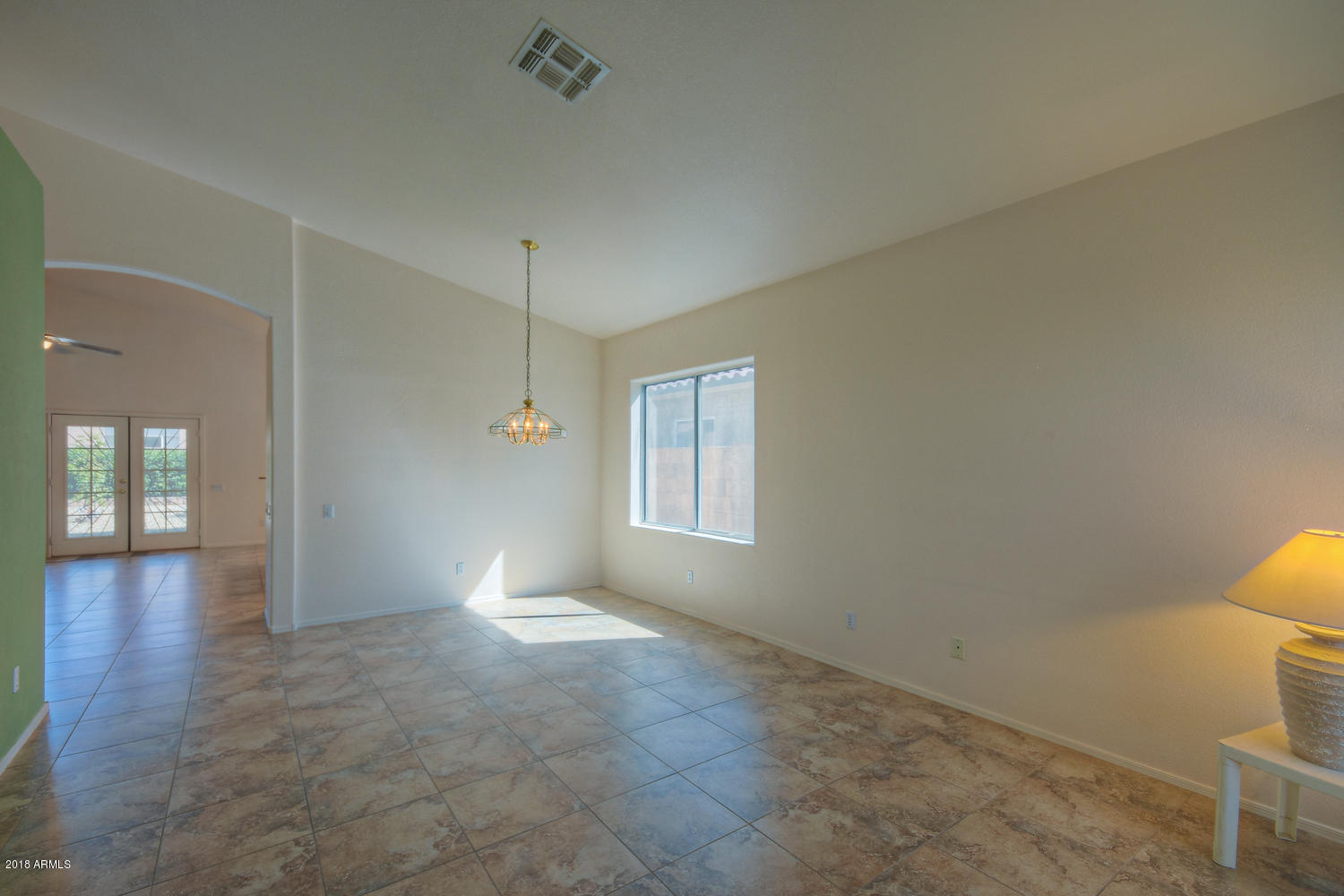 124 West Grandview Road Phoenix, AZ 85023 - Photo 3 of 21 a view of empty room with wooden floor and fan
