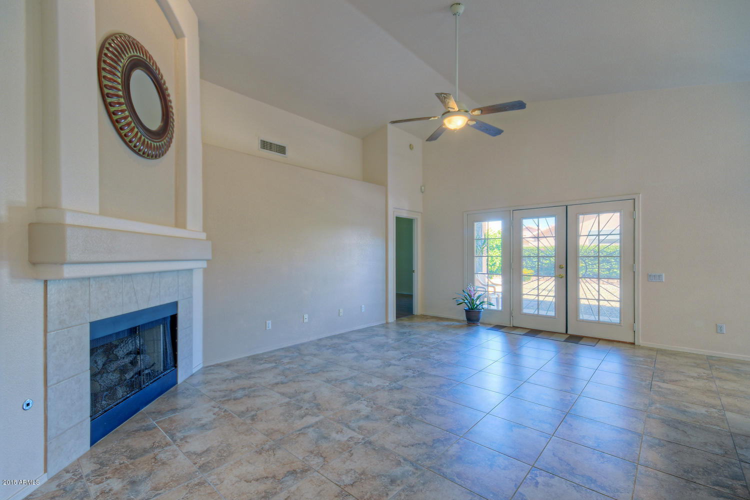 124 West Grandview Road Phoenix, AZ 85023 - Photo 5 of 21 a view of empty room with wooden floor and fan