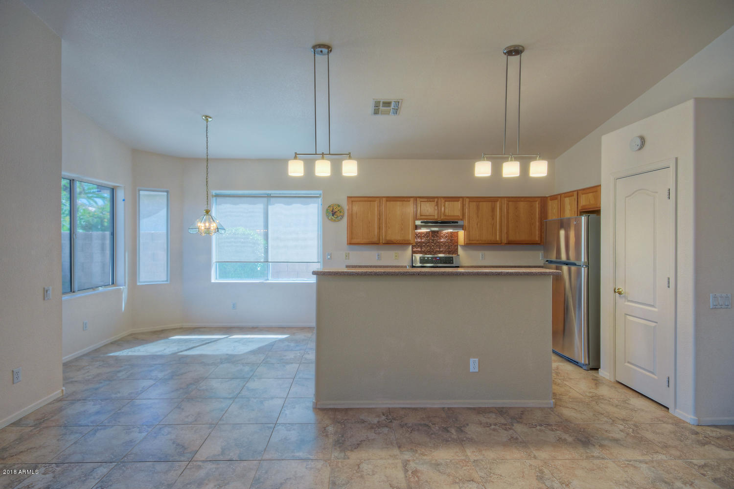 124 West Grandview Road Phoenix, AZ 85023 - Photo 8 of 21 a view of a kitchen with refrigerator and windows