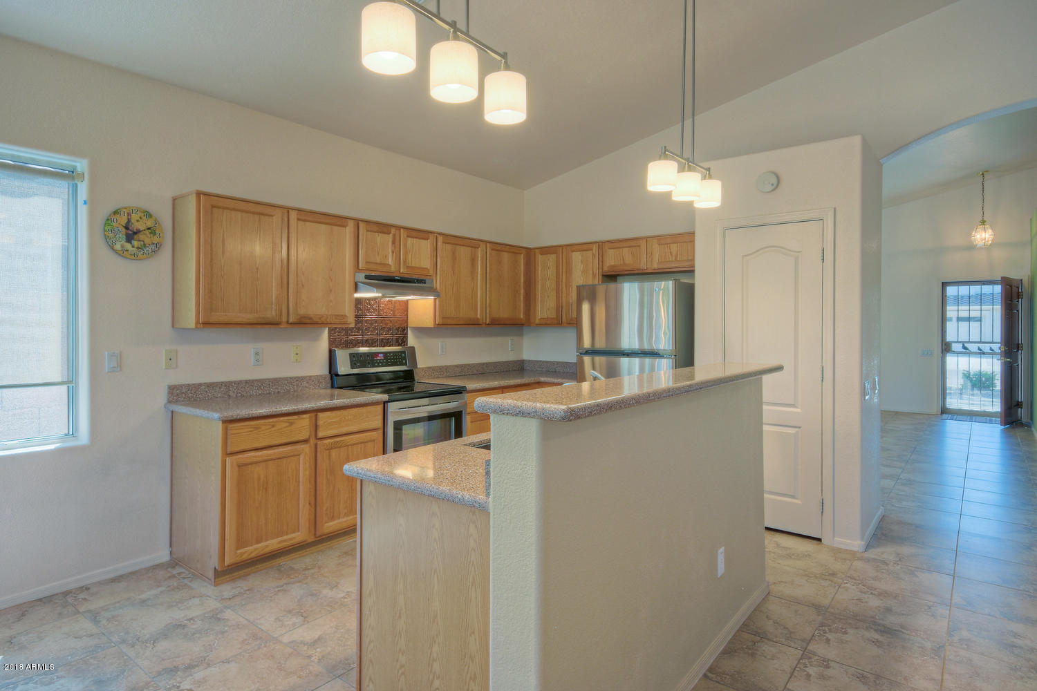 124 West Grandview Road Phoenix, AZ 85023 - Photo 9 of 21 a kitchen with granite countertop white cabinets and stainless steel appliances