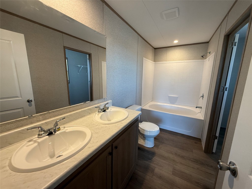 175 Altidore Avenue Dale, TX 78616 - Photo 11 of 21 a bathroom with a granite countertop sink toilet and shower