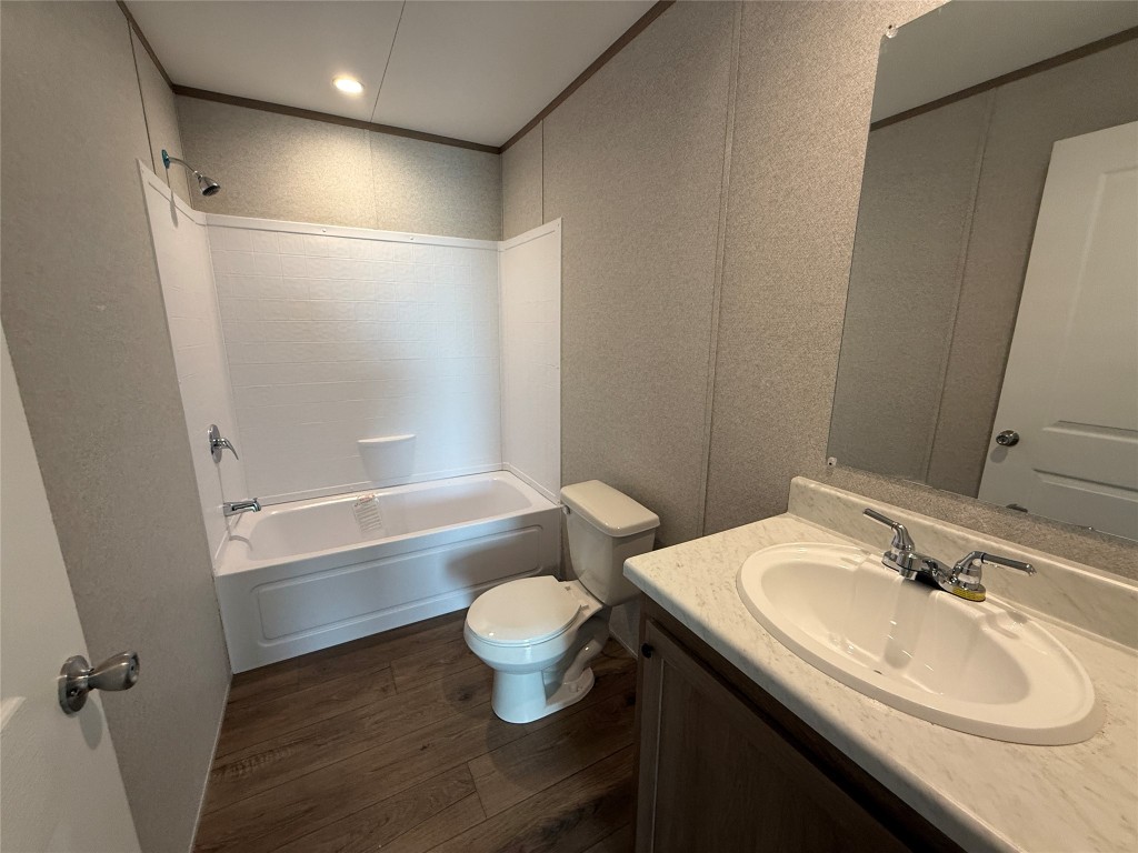 175 Altidore Avenue Dale, TX 78616 - Photo 16 of 21 a bathroom with a sink and a mirror