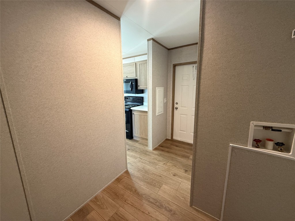 175 Altidore Avenue Dale, TX 78616 - Photo 6 of 21 a view of a kitchen from the hallway